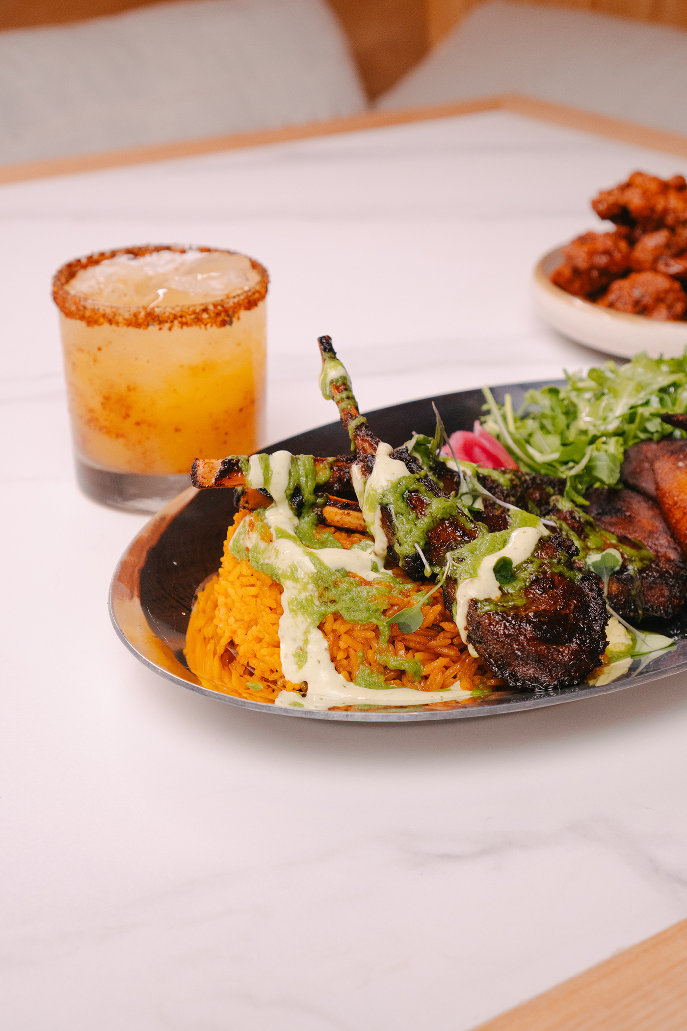 Lamb and jollof with cocktail