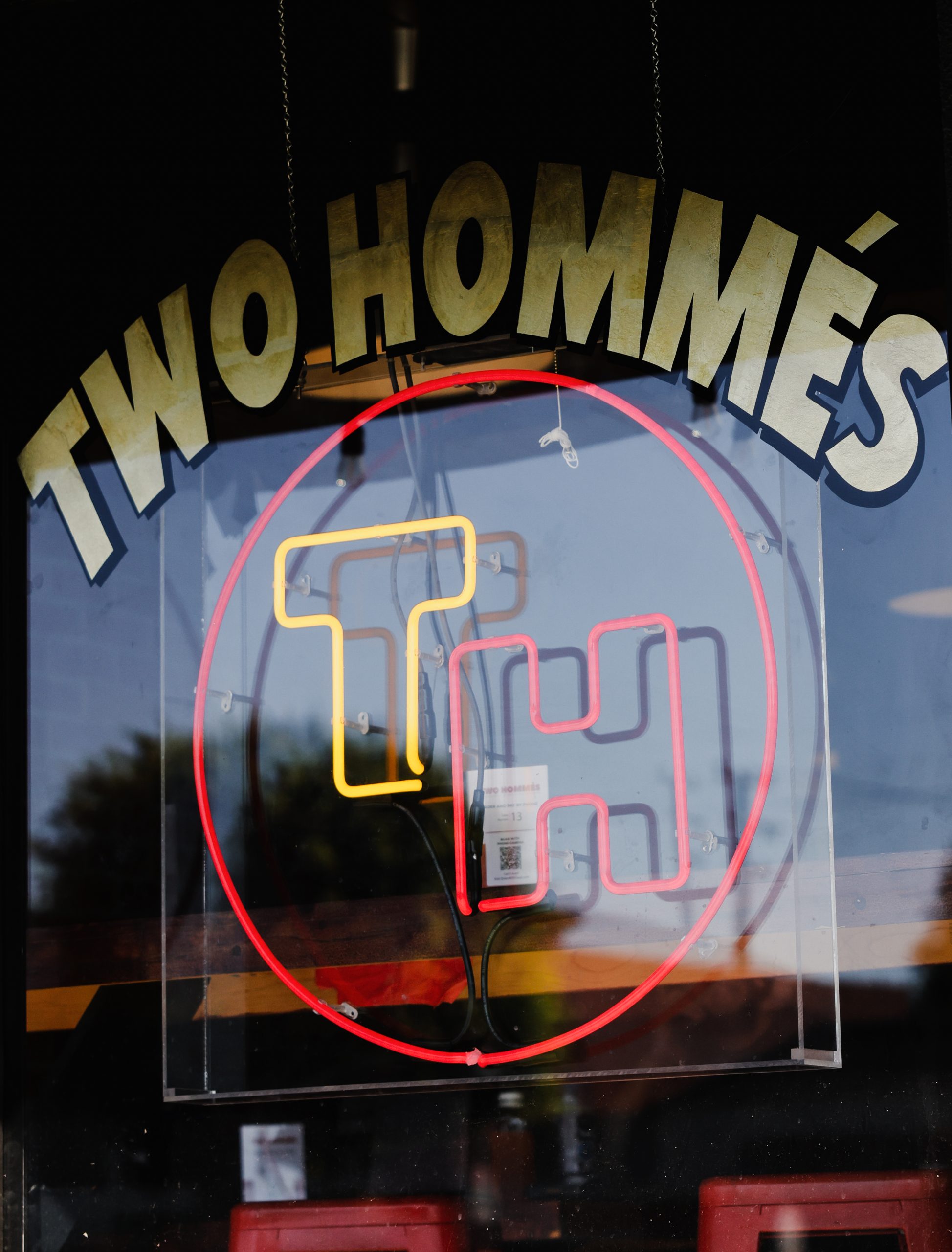 Two Hommes storefront hero